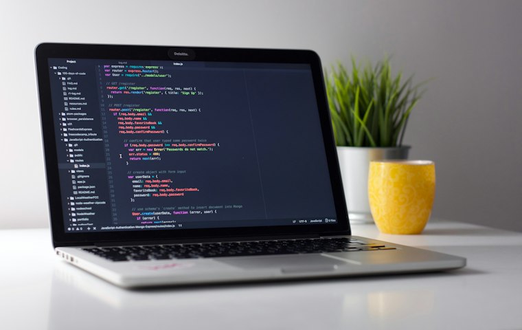 Laptop with source code on screen