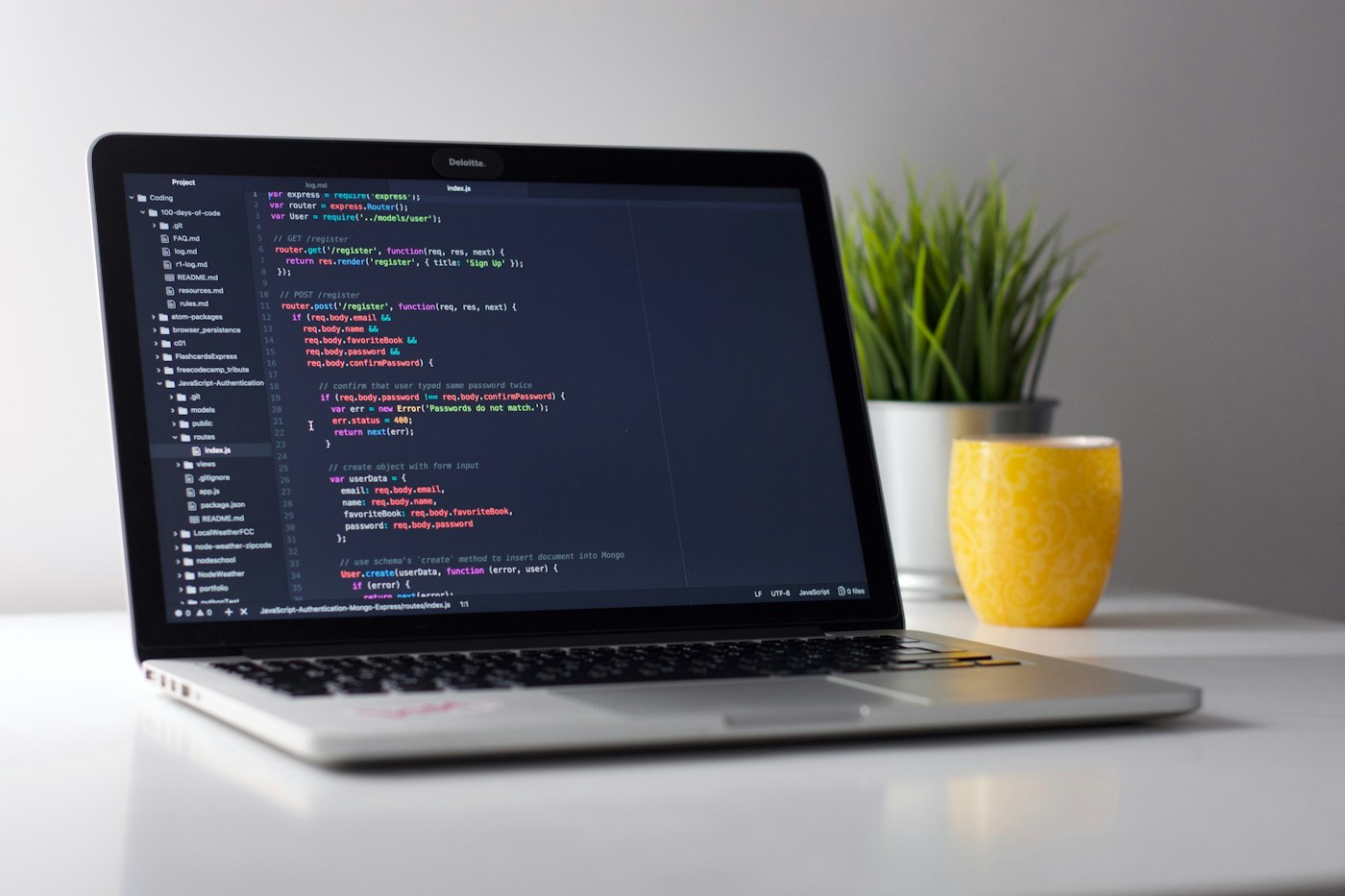 Laptop with source code on screen
